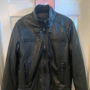 Men’s sz M vegan leather, faux fur lined warm black jacket. New condition.
